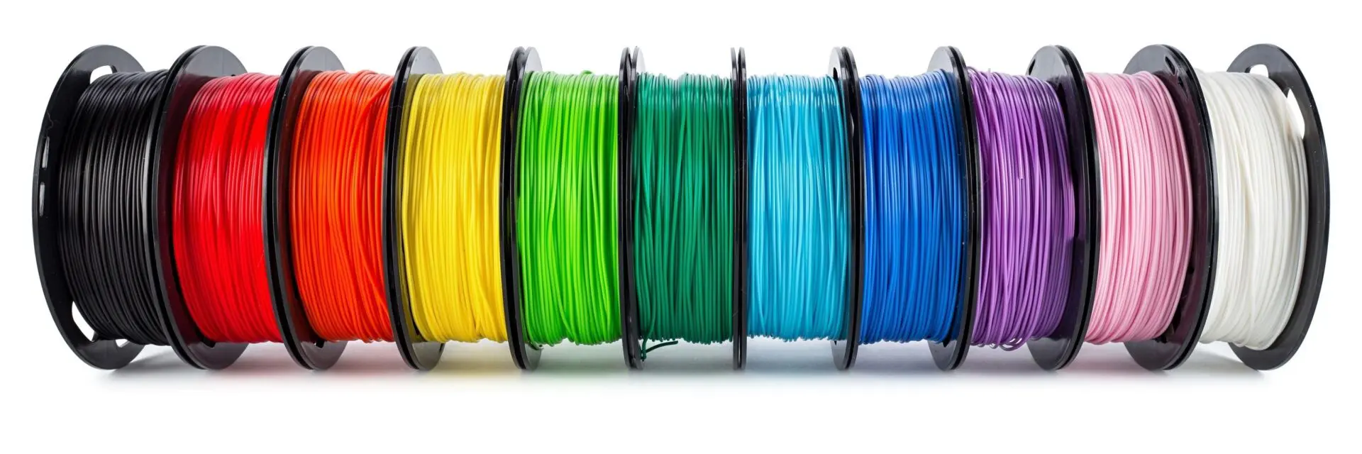 A row of different colored wires sitting on top of each other.